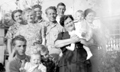 Ray (center) with his mother Thelma (dark dress), his brother Jess (lower left), and the Parker Family